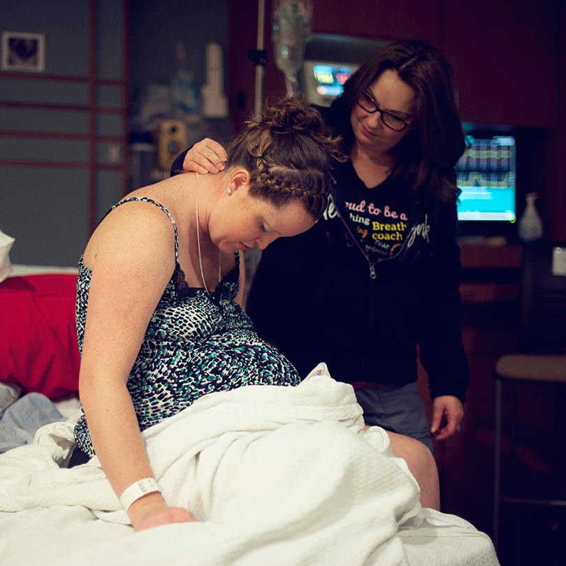 Silver spring doula rubbing a client's neck during labor